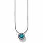 Brighton pendant necklace with round teal crystal and silver-plated beaded frame on snake chain on a white background