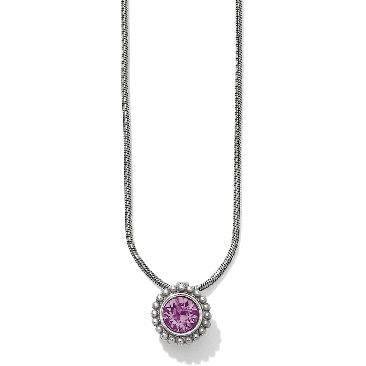 Brighton pendant necklace with round purple crystal and silver-plated beaded frame on snake chain on a white background