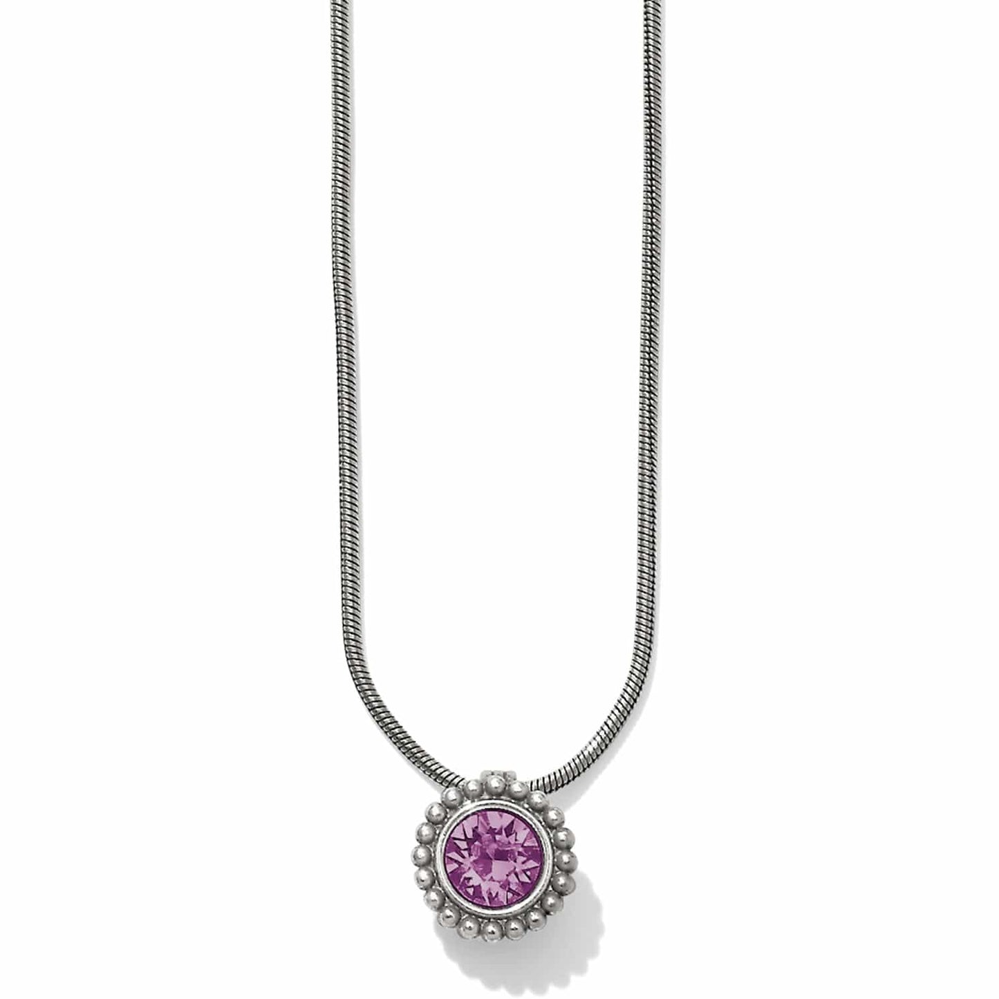 Brighton pendant necklace with round purple crystal and silver-plated beaded frame on snake chain on a white background
