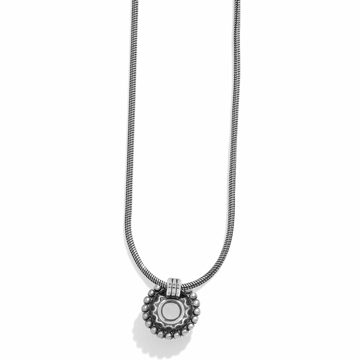 Brighton pendant necklace with silver-plated round medallion, beaded border, and snake chain on a white background