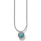 Brighton pendant necklace with round blue crystal and silver-plated beaded frame on snake chain on a white background