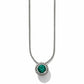 Brighton pendant necklace with green crystal center and beaded silver-plated frame on snake chain on a white background