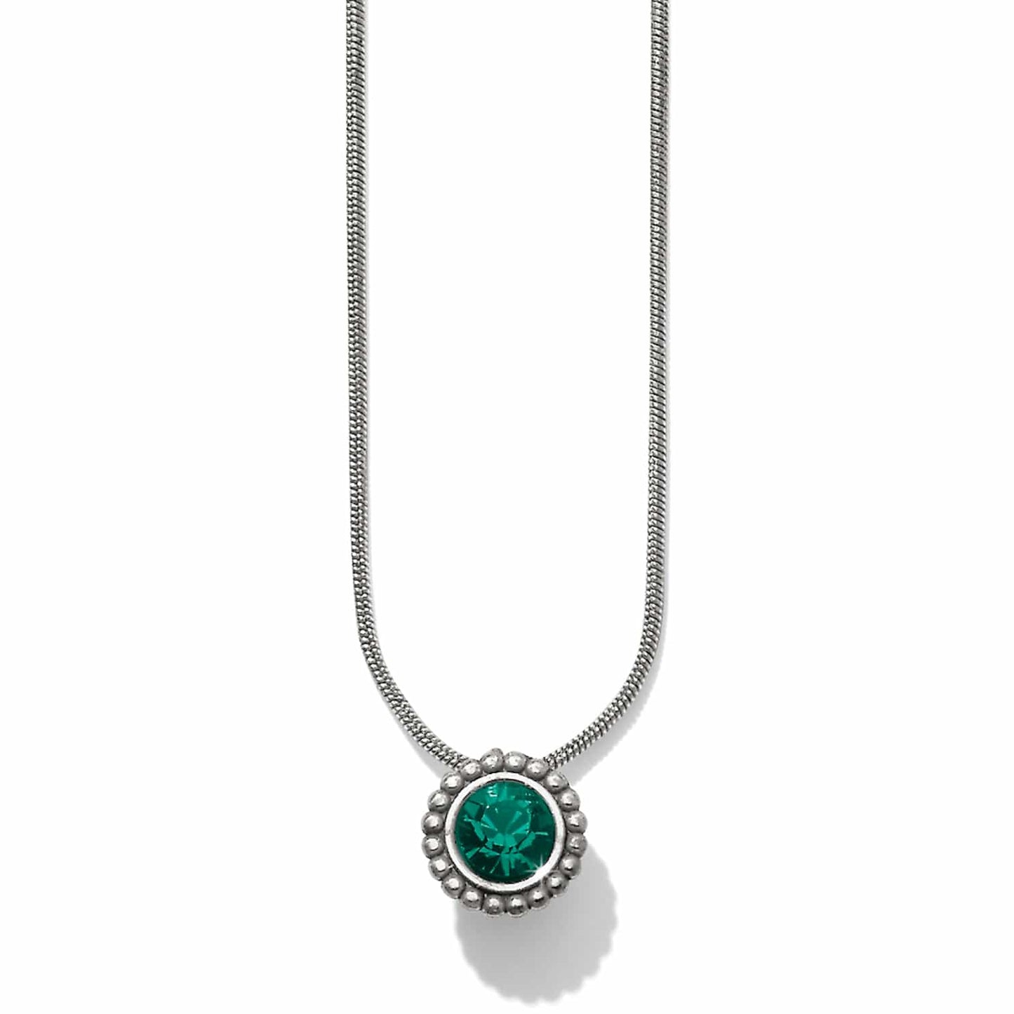 Brighton pendant necklace with green crystal center and beaded silver-plated frame on snake chain on a white background