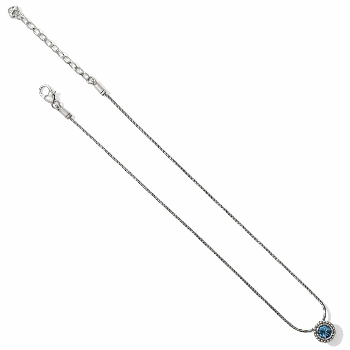 Brighton silver-plated pendant necklace with round blue crystal and beaded bezel detail on a white background