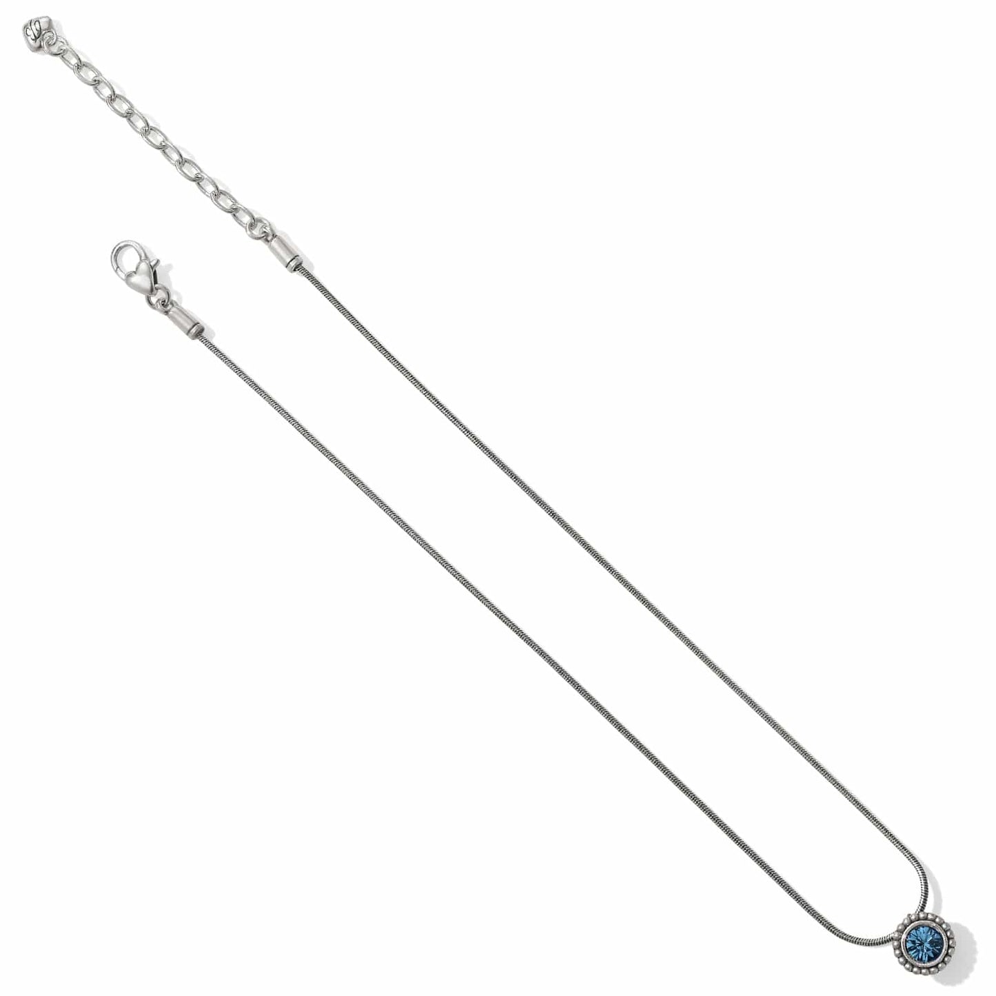 Brighton silver-plated pendant necklace with round blue crystal and beaded bezel detail on a white background
