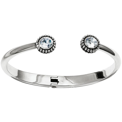 Brighton hinged cuff bracelet with silver-plated finish and two crystal end caps with beaded borders on a white background