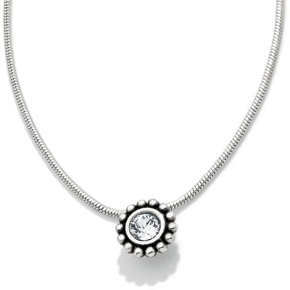 Brighton pendant necklace with silver-plated beaded frame surrounding a round crystal on a white background