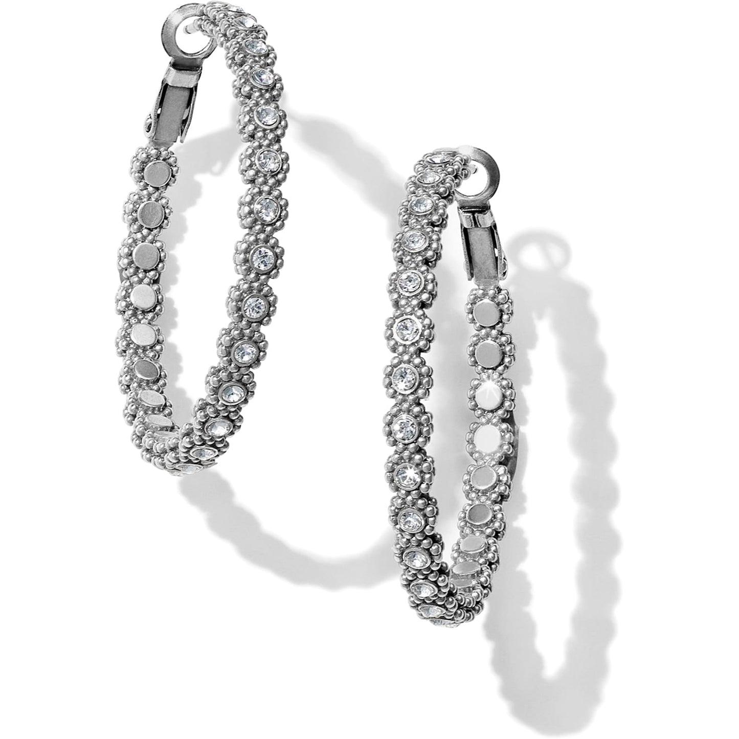 Brighton silver-plated hoop earrings with beaded texture and pavé crystal accents on a white background
