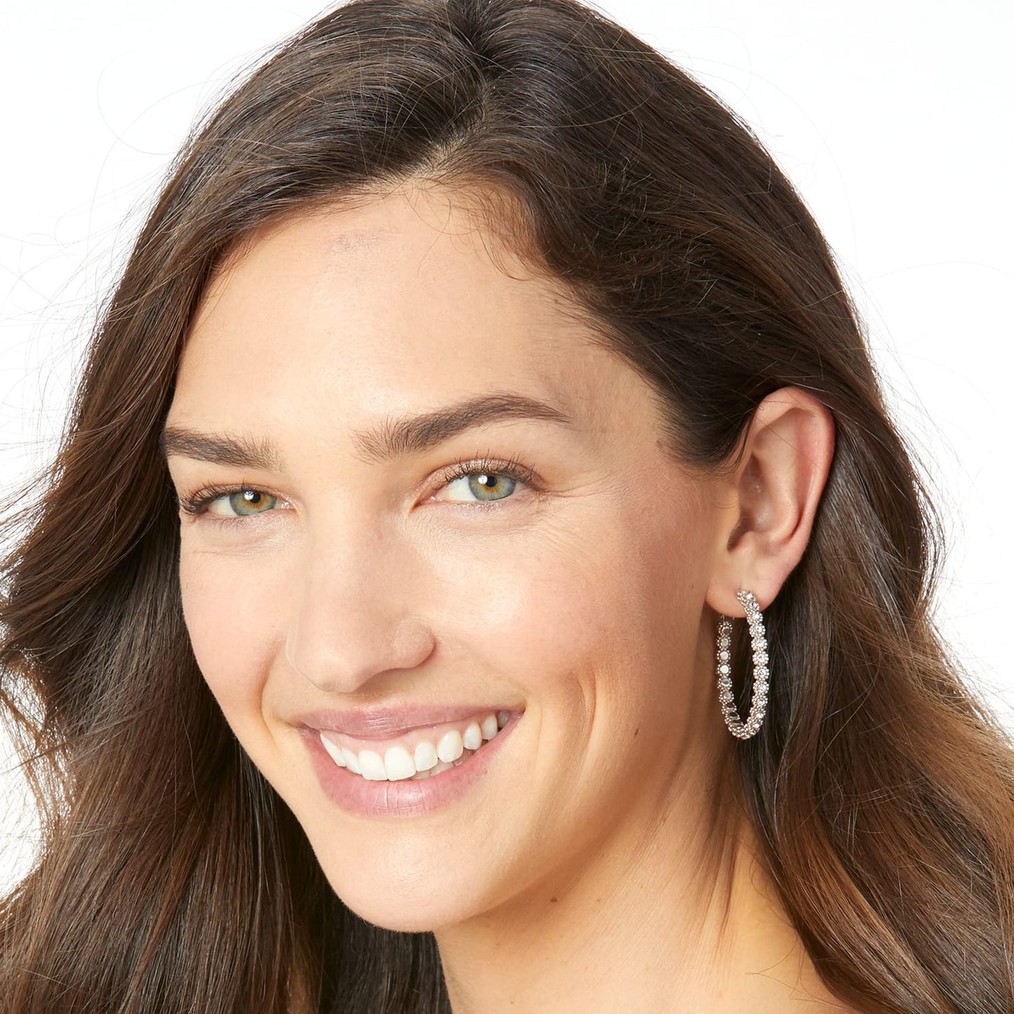 Model wearing a Brighton silver-plated hoop earring embellished with fine quality crystals along the band