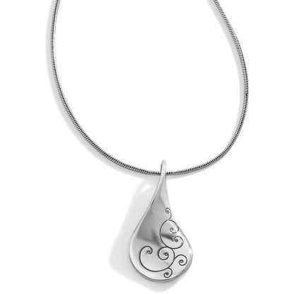 Brighton pendant necklace with silver-plated teardrop pendant featuring swirl detailing on a snake chain on a white background