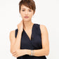 Model wearing Brighton silver-plated hoop earrings paired with stacked silver-plated engraved bangle bracelets on wrist