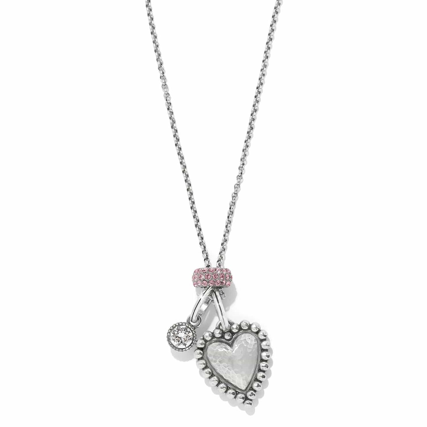 Brighton pendant necklace with hammered silver-plated heart, crystal charm, and pink crystal bail on a white background