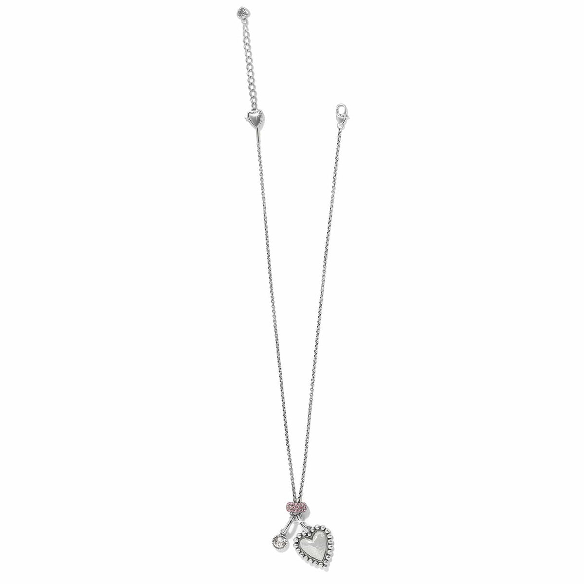 Brighton silver-plated necklace with hammered heart pendant, crystal charm, and pink crystal accent on a white background
