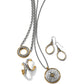 Brighton jewelry set styled with silver and gold-plated necklaces, hoop earrings, and drop earrings featuring scroll engravings