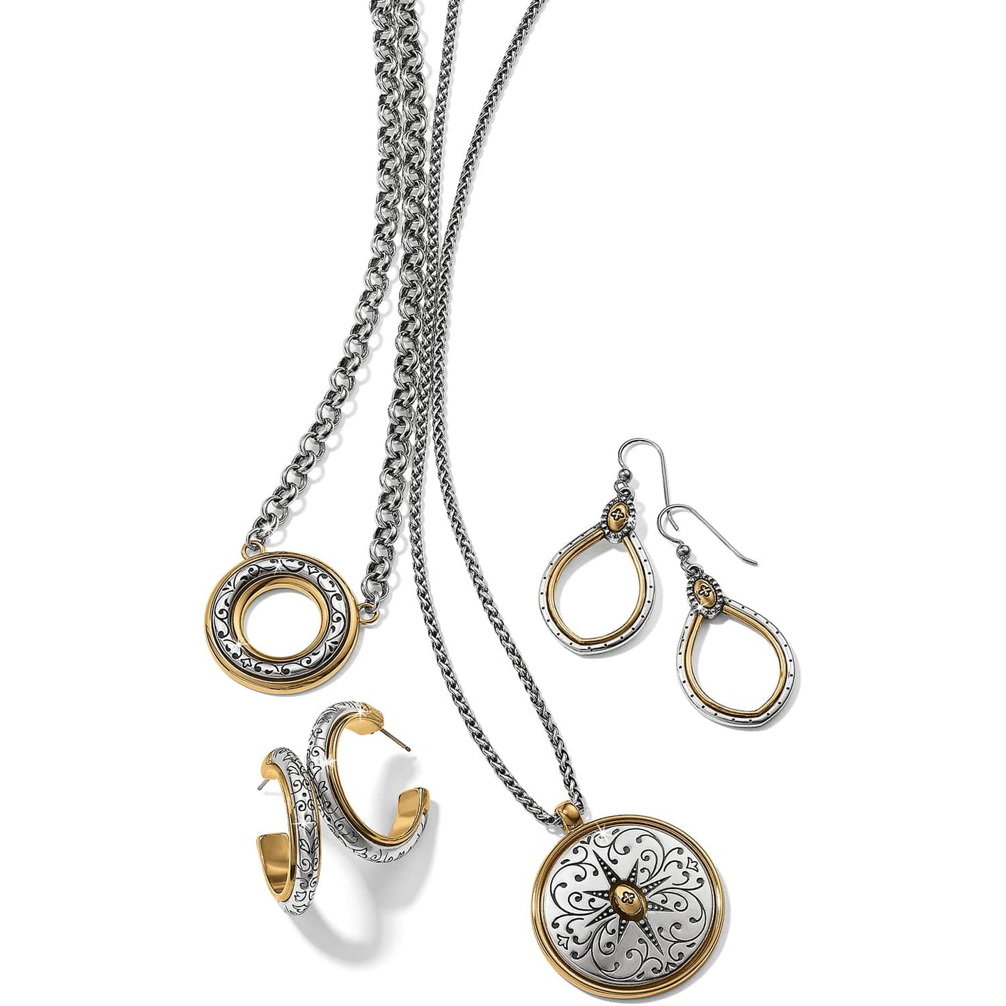 Brighton jewelry set styled with silver and gold-plated necklaces, hoop earrings, and drop earrings featuring scroll engravings