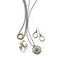 Brighton two-tone jewelry set styled with silver chain necklaces, circle pendant, and matching hoop and drop earrings