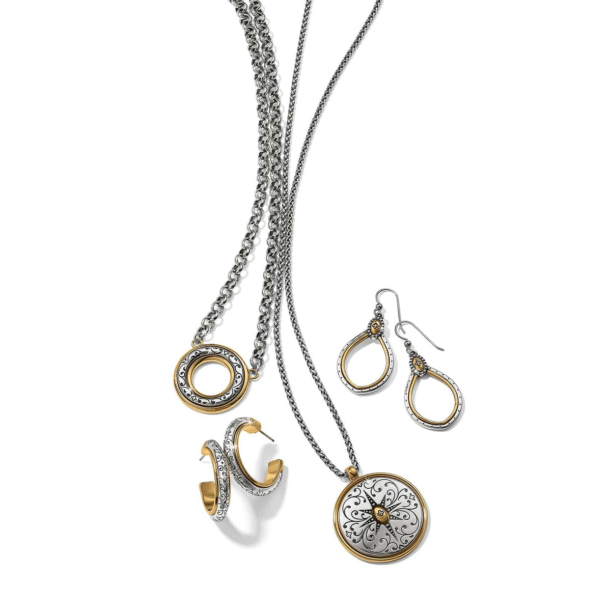 Brighton two-tone jewelry set styled with silver chain necklaces, circle pendant, and matching hoop and drop earrings