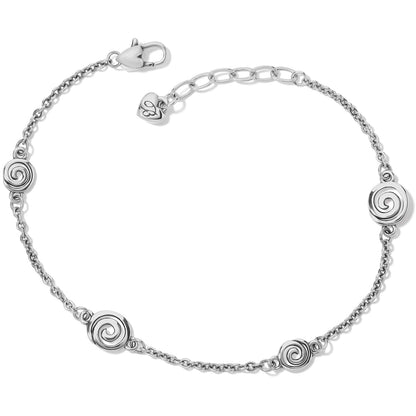 Brighton silver-plated chain bracelet with four spiral disc stations and lobster clasp on a white background