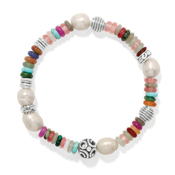Brighton beaded bracelet with glass pearls, mixed gemstones, fuchsia dyed jade, and silver-plated accents on a white background