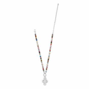 Brighton beaded necklace with multicolored gemstones, glass pearls, and silver-plated swirl pendant on a white background