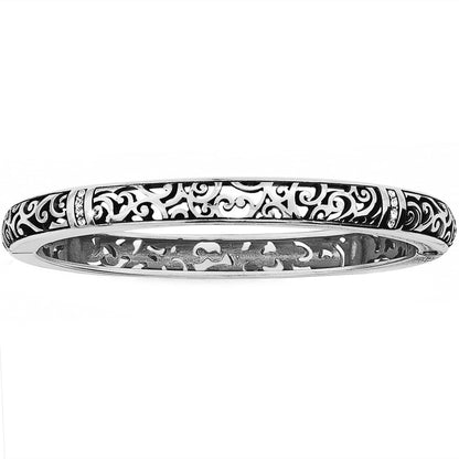 Brighton bangle bracelet with silver-plated openwork scroll design and crystal accents on a white background