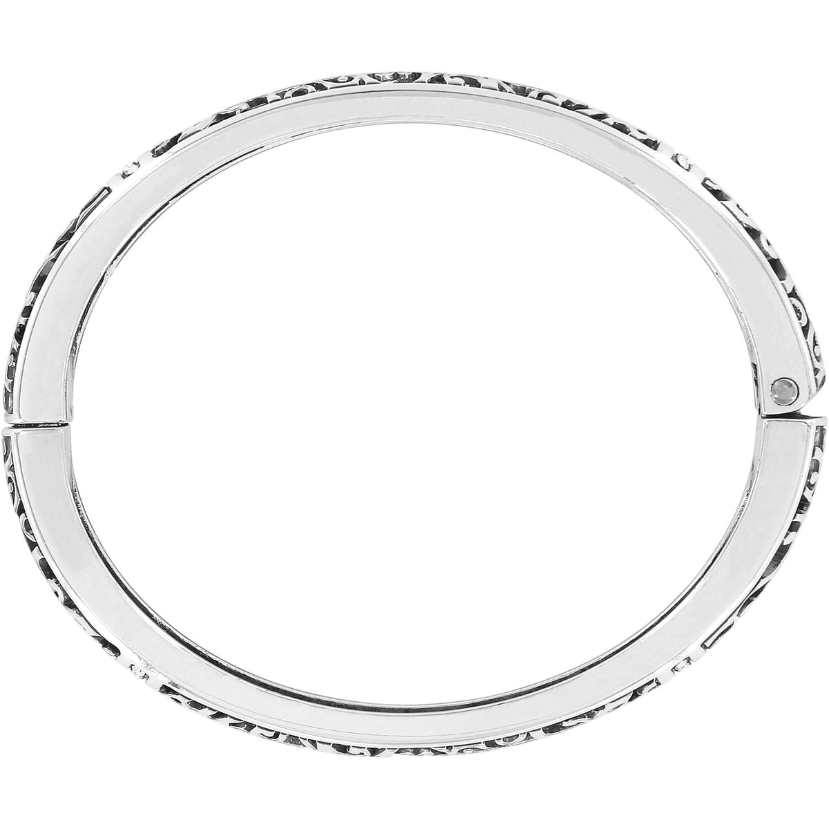 Brighton hinged bangle bracelet with silver-plated finish and scrollwork detailing along the sides on a white background