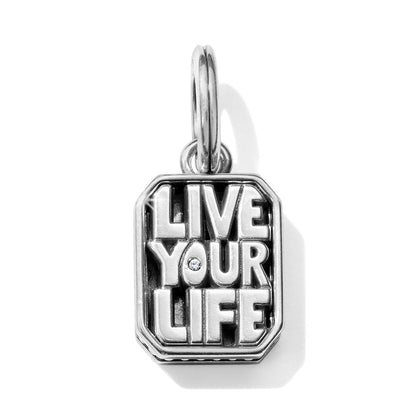Brighton charm with silver-plated rectangular tag reading Live Your Life and a small crystal accent on a white background