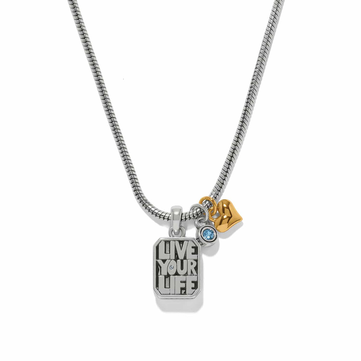 Brighton charm necklace with Live Your Life tag, blue crystal, and gold-tone heart on a white background