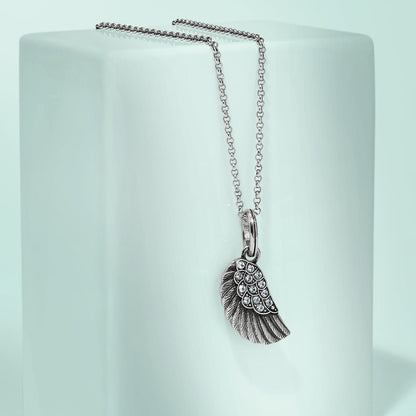 Brighton pendant necklace with silver-tone wing charm and crystal accents on a pale mint background