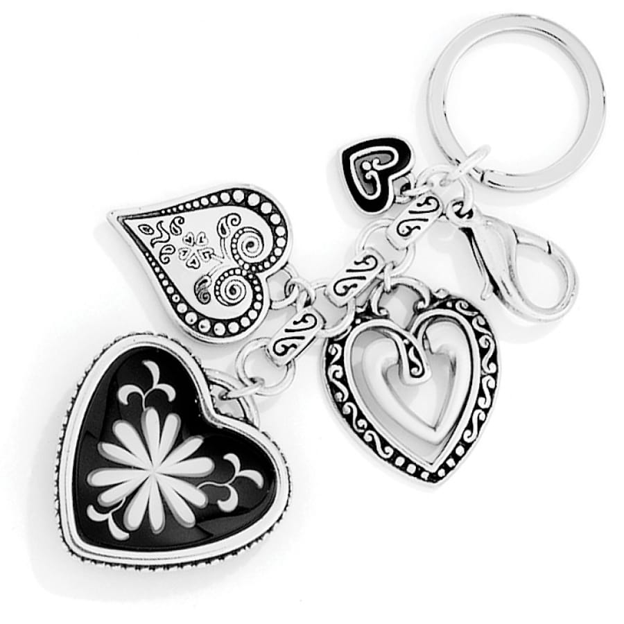 Brighton keychain with silver-plated heart charms, black enamel floral center, and lobster clasp on a white background