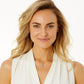 Model wearing a Brighton two-tone cross pendant necklace with crystal accents paired with matching gold-tone stud earrings