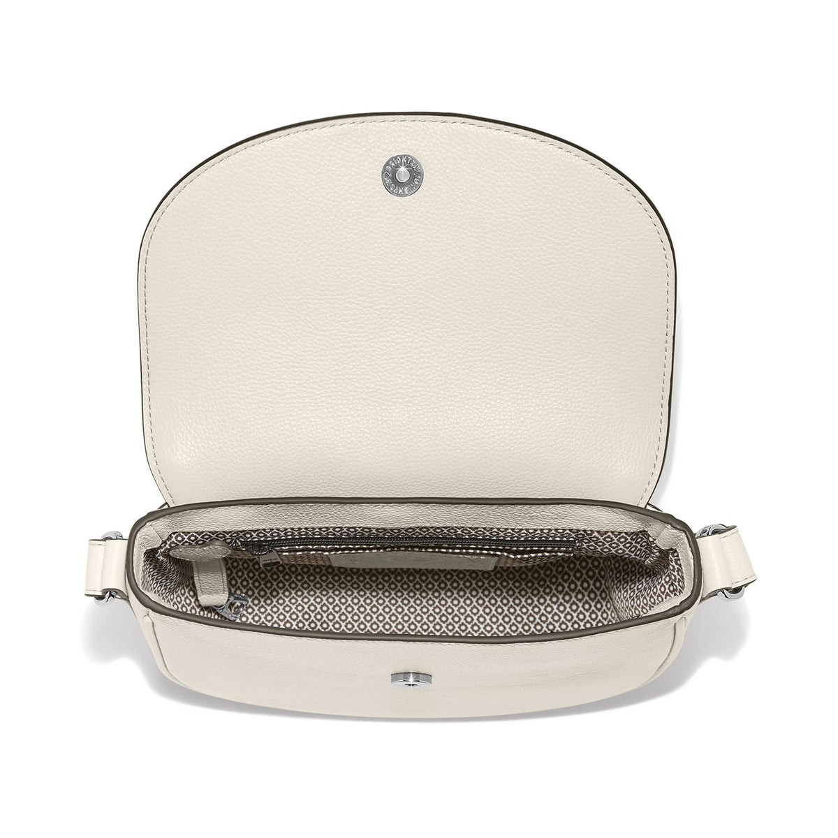 Brighton handbag shown open with cream leather flap, patterned fabric interior, and silver-tone snap closure on a white background