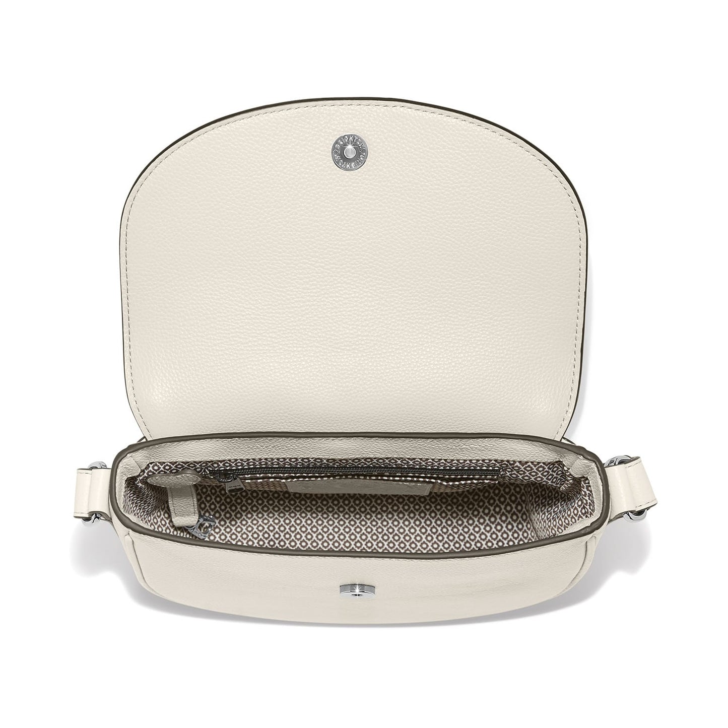 Brighton handbag shown open with cream leather flap, patterned fabric interior, and silver-tone snap closure on a white background