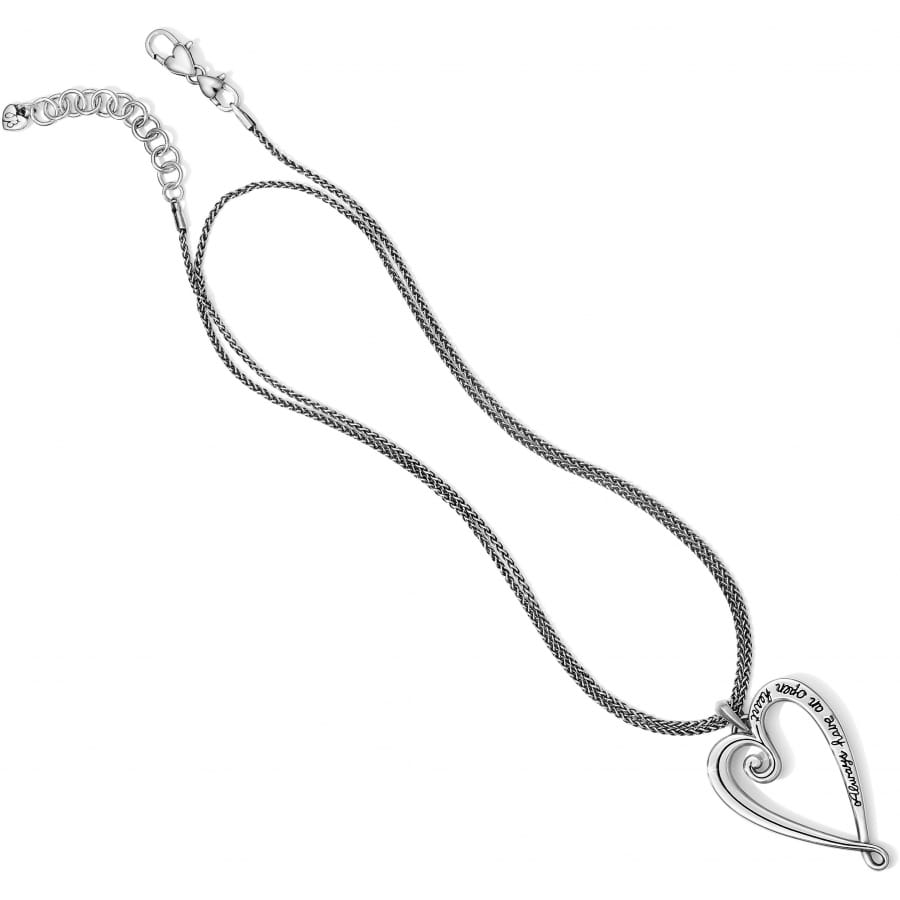 Brighton pendant necklace with silver-plated open heart charm and engraved script on rope chain on a white background