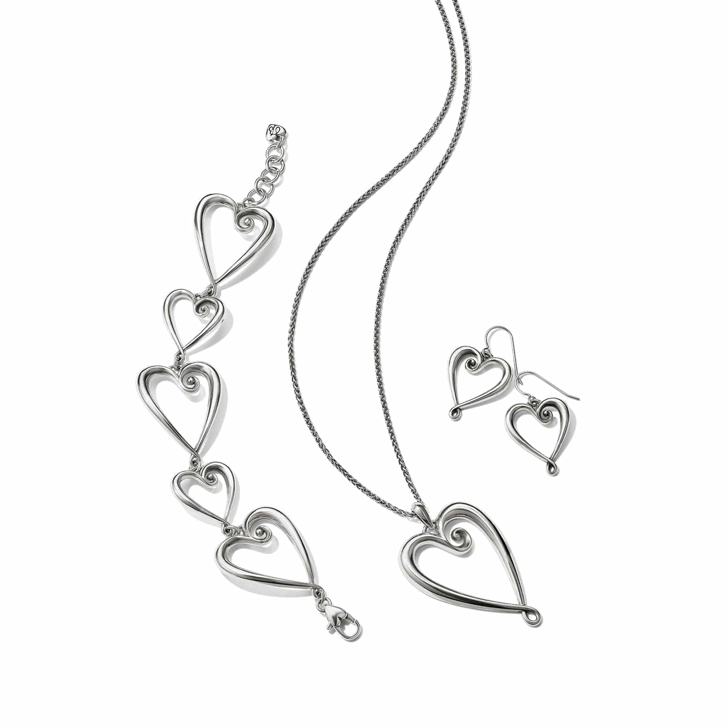 Brighton silver-plated heart jewelry set styled with matching pendant necklace, linked bracelet, and drop earrings