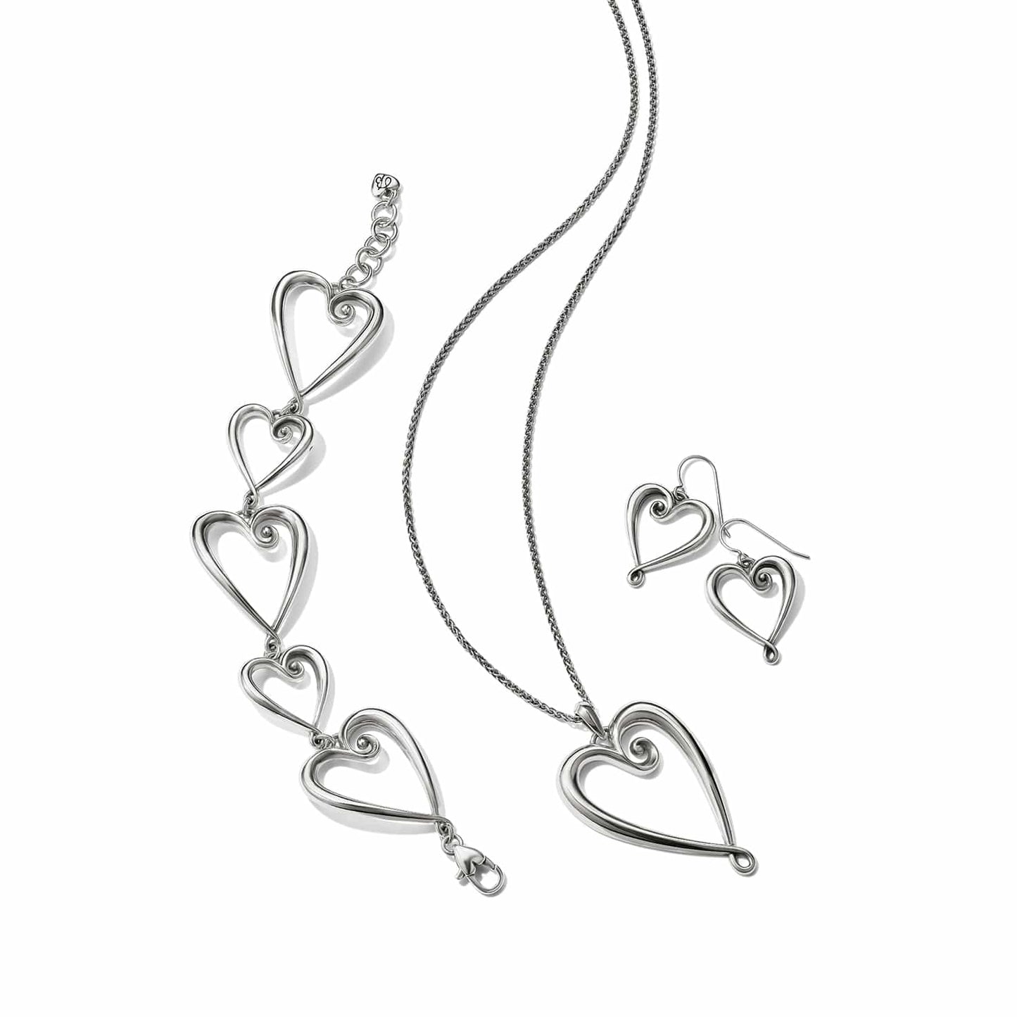 Brighton silver-plated heart jewelry set styled with matching pendant necklace, linked bracelet, and drop earrings