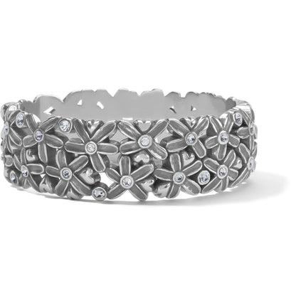 Brighton hinged bangle bracelet with silver-plated floral design and crystal centers on a white background