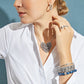 Model wearing a Brighton silver-plated heart necklace with floral design and coordinating Brighton accessories including earrings and bracelets