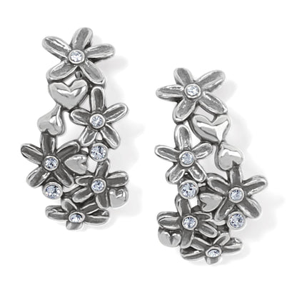 Brighton hoop earrings with silver-plated flowers, hearts, and crystal accents on a white background