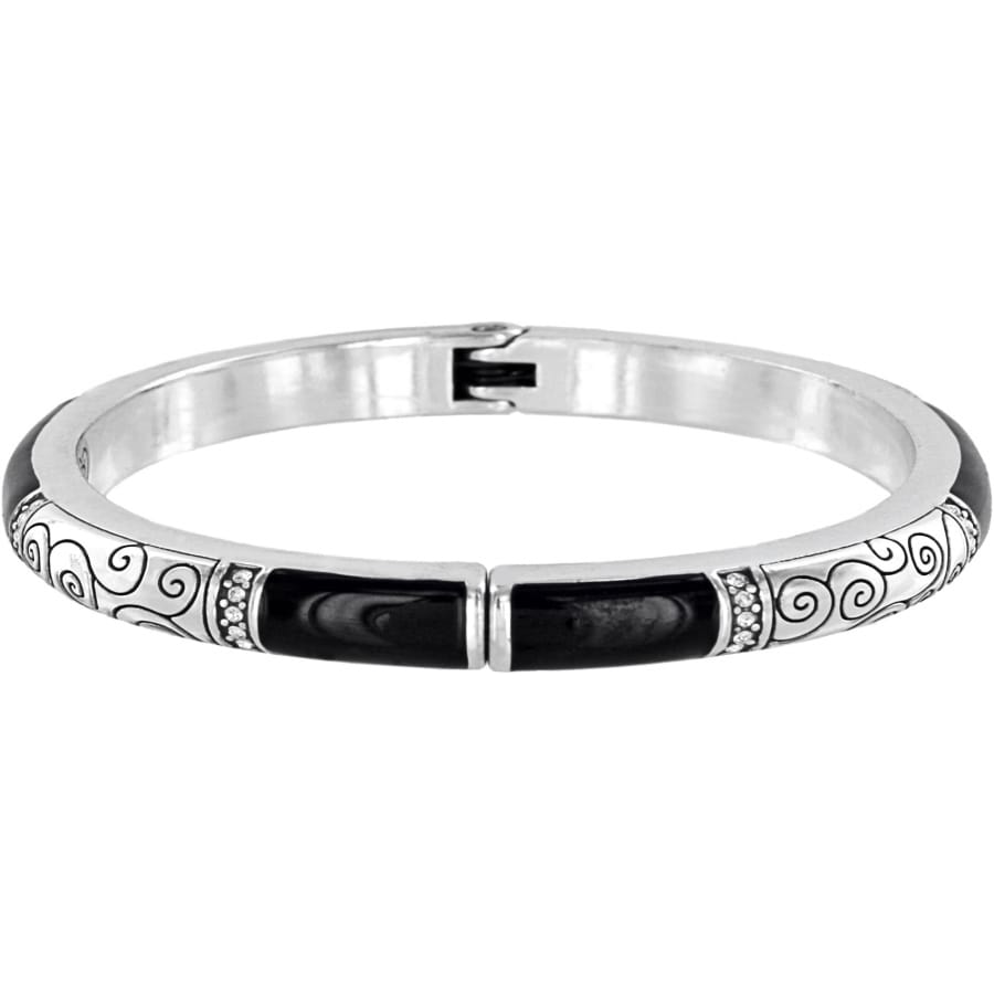 Brighton hinged bangle bracelet with silver-plated scroll detail, crystal accents, and black enamel stations on a white background