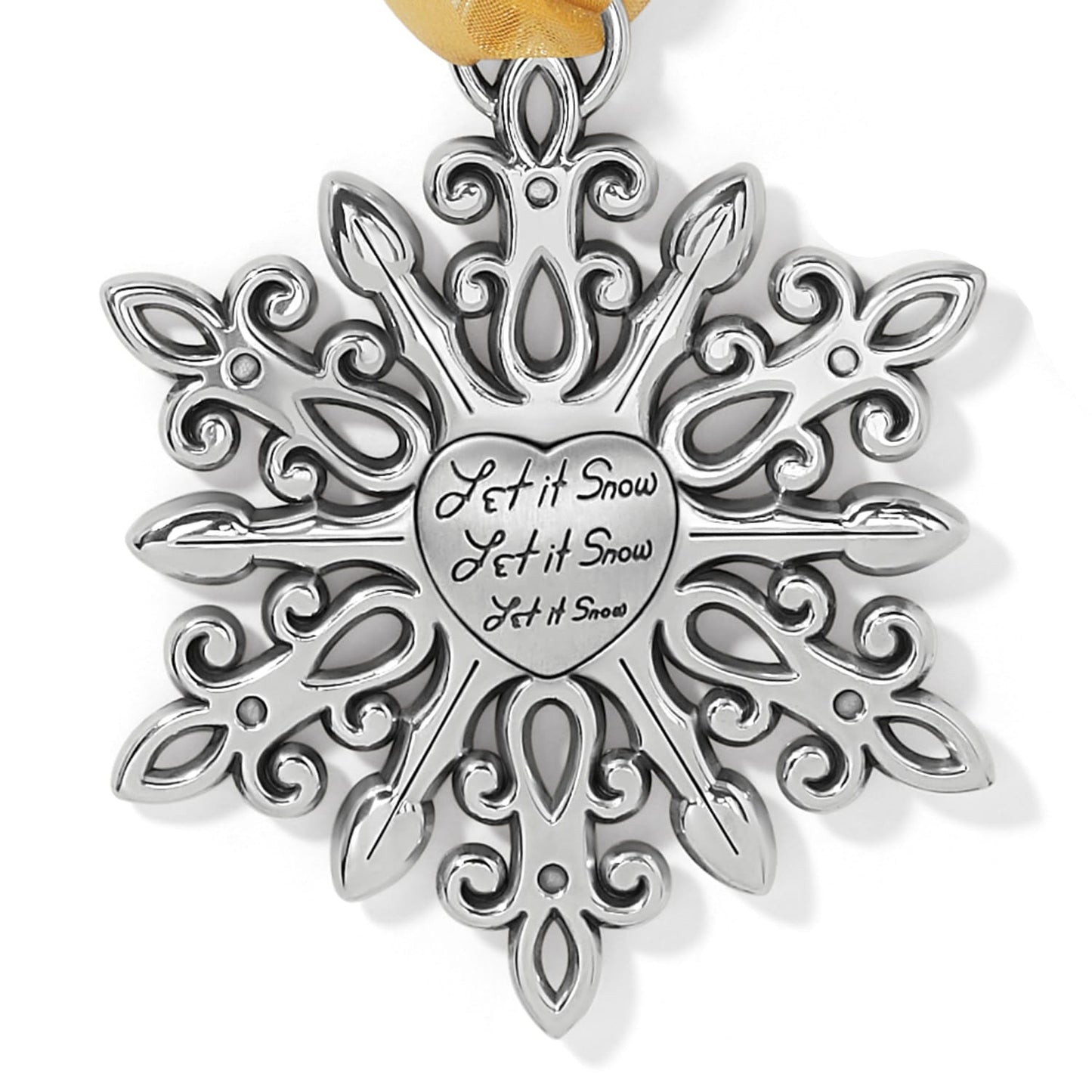 Brighton snowflake ornament with silver-plated scrollwork, engraved Let it Snow heart center, and gold ribbon on a white background