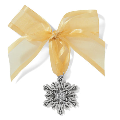 Brighton snowflake ornament with silver-plated finish, crystal center accents, and gold sheer ribbon bow on a white background