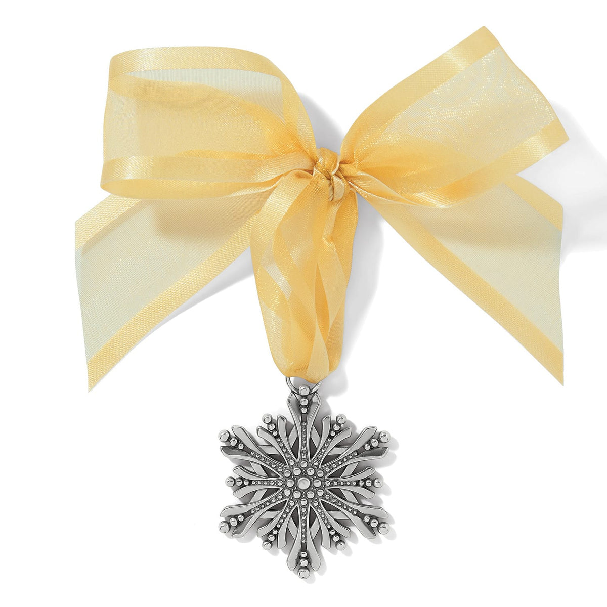 Brighton silver-plated snowflake ornament with beaded detailing hanging from a sheer gold ribbon bow on a white background