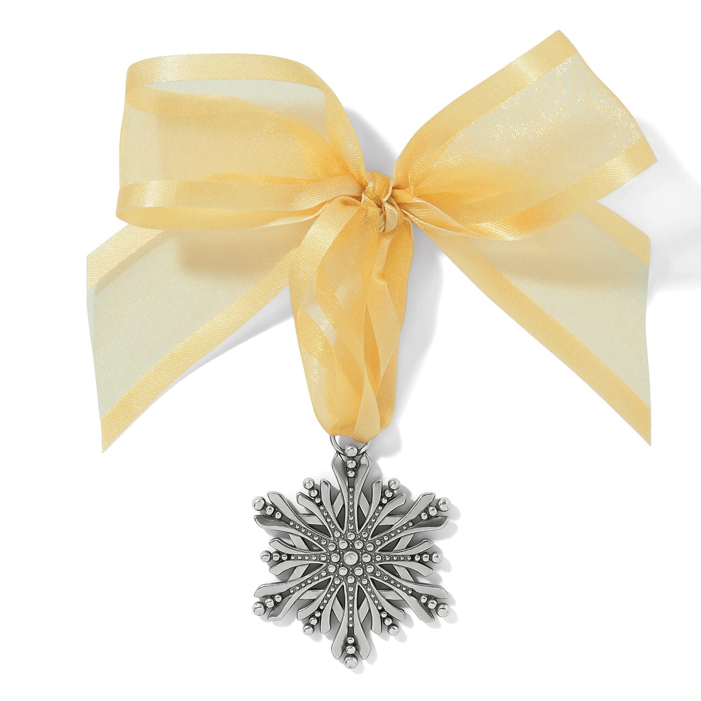 Brighton silver-plated snowflake ornament with beaded detailing hanging from a sheer gold ribbon bow on a white background