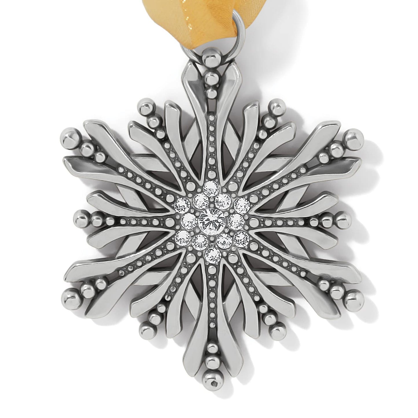 Brighton snowflake ornament with silver-plated finish, crystal center cluster, and yellow ribbon on a white background