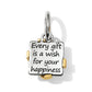 Brighton charm shown from the back with engraved happiness message and gold-tone accents on a white background