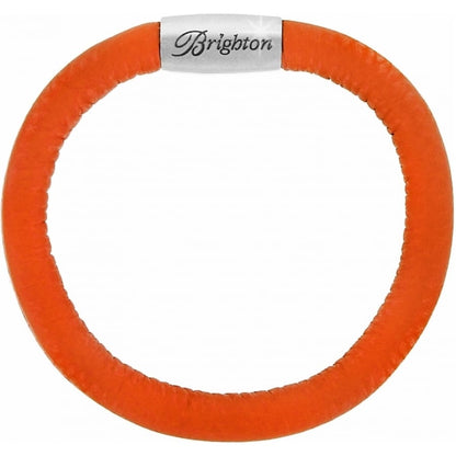 Brighton bracelet in orange leather with silver-plated magnetic clasp engraved with the brand name on a white background