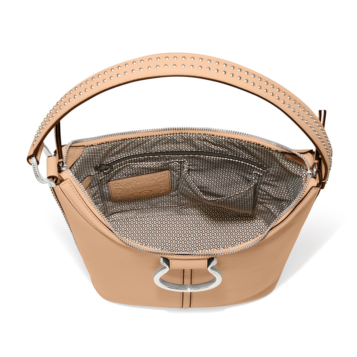 Brighton tan leather handbag shown open with patterned interior lining, studded strap, and silver-tone ring accent on a white background