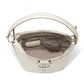 Brighton ivory leather handbag shown open with patterned interior lining, studded strap, and silver-tone ring hardware on a white background