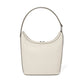 Brighton handbag in cream pebbled leather with silver-tone studded trim and curved shoulder strap on a white background